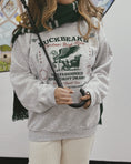 Load image into Gallery viewer, Buckbeak Sleigh Rides Sweatshirt

